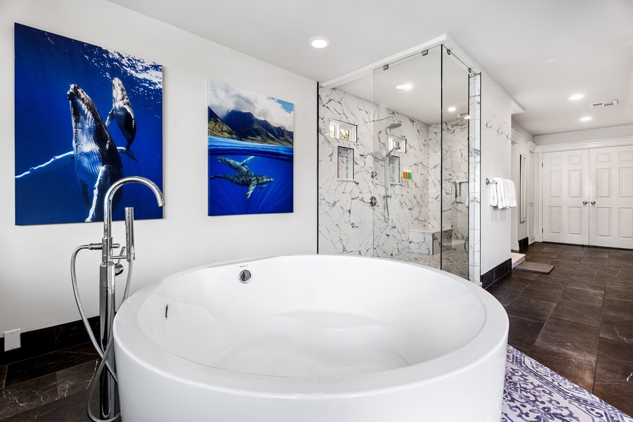Modern soaking tub with walk-in shower in the luxurious primary bath.
