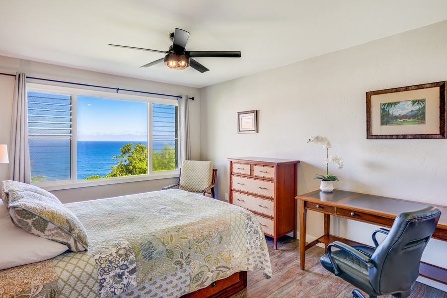 Wake up to the tropical beauty from the primary suite.
