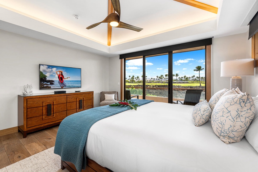 The primary suite features a king bed, serene decor, and natural light.