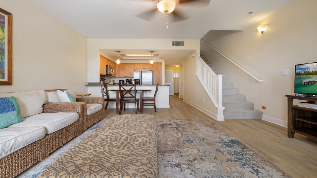 An inviting open layout connects the dining area, living room, and kitchen—ideal for relaxing or entertaining after a day at the lagoons.