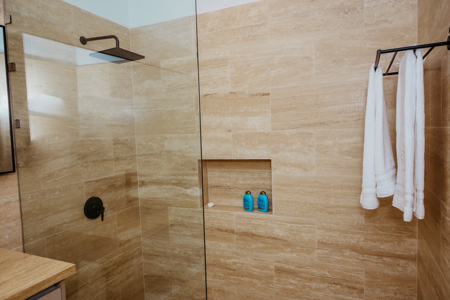 Freshen up in the walk-in shower of the ensuite bath.