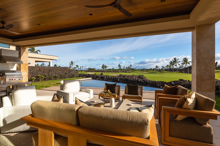 Multiple lounging and dining areas on the expansive lanai.