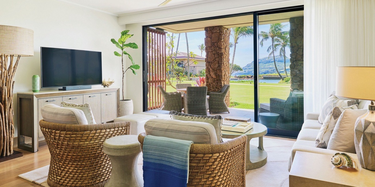 Walls of sliding glass doors create a true Hawaiian indoor-outdoor living experience.