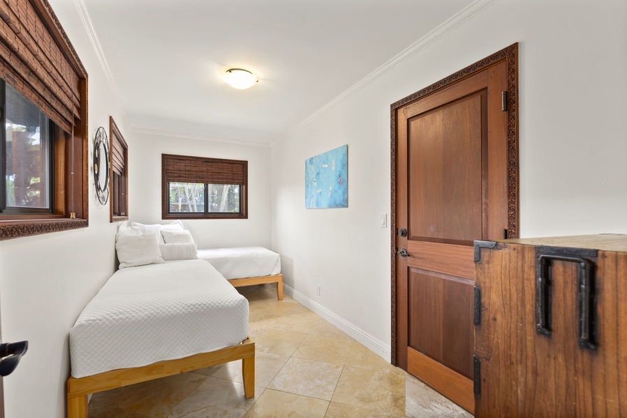 The fourth guest bedroom has two twin beds, perfect for the little ones.