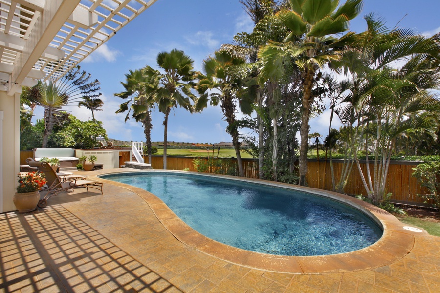 backyard with pool and golf course view