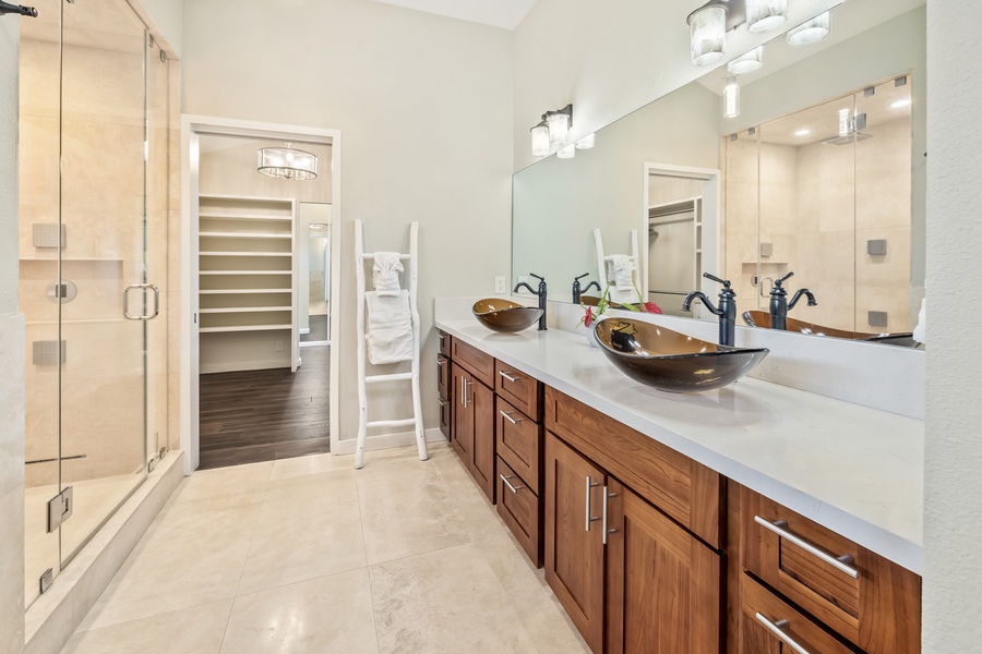 Elegant bathroom with double vanities and plenty of storage space.