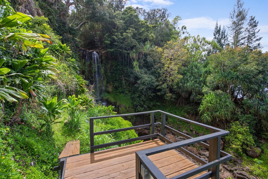 Stroll along the scenic path to the estate’s private waterfall deck.