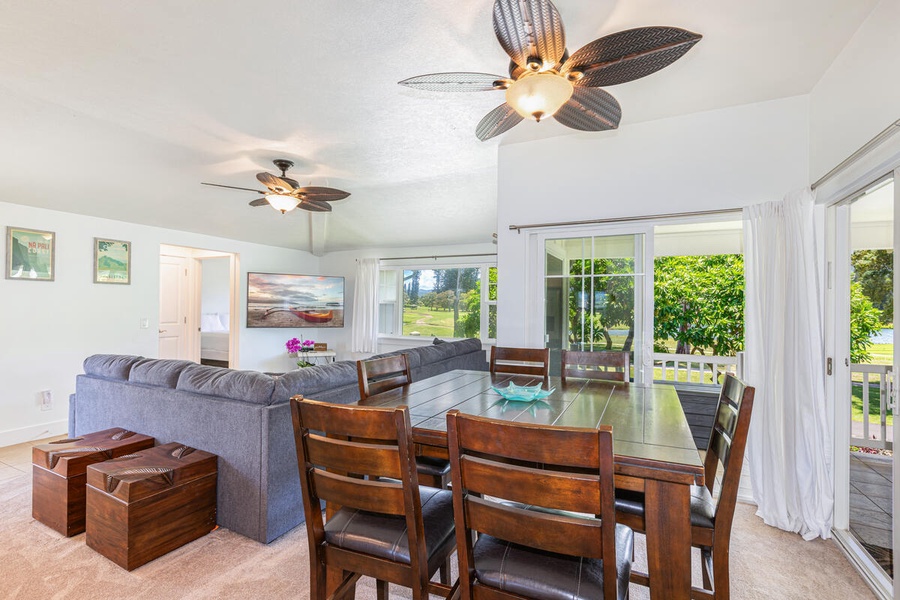 Dining area with ceiling fan and views, perfect for shared meals or game nights.
