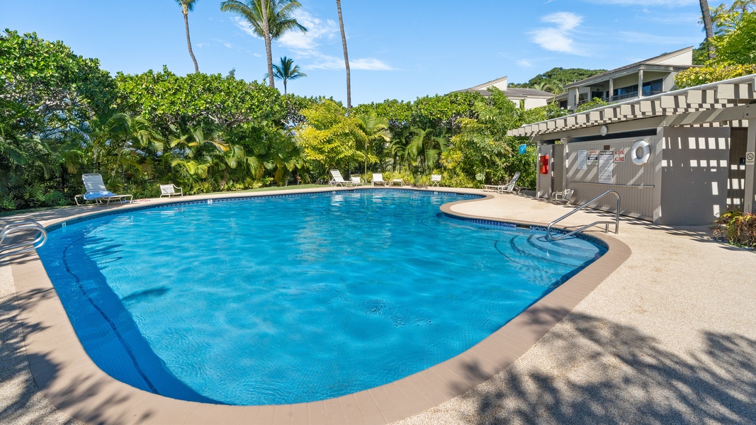 Take a refreshing dip in the pool at Wailea Ekolu 1106, surrounded by tropical greenery.