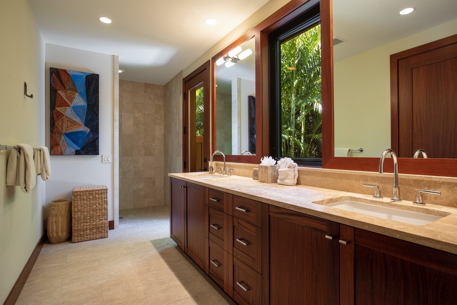 Guest bedroom one en-suite bath with dual vanities, walk-in shower and outdoor shower garden.