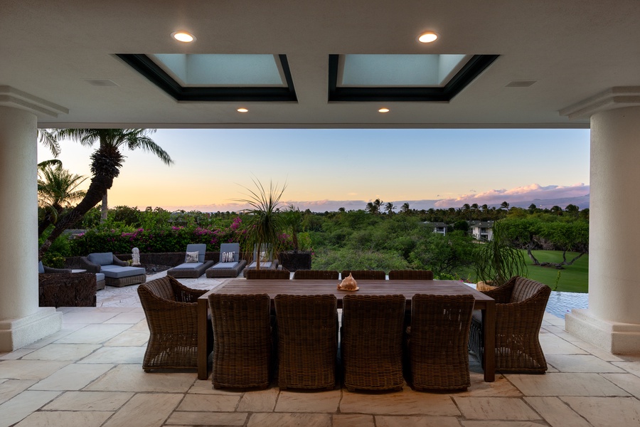 Spacious outdoor dining area with panoramic views, perfect for enjoying evening meals as the sun sets.