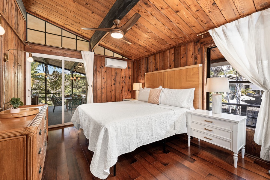 Drift off in your cozy cabin-style bedroom with warm wood and crisp linens.