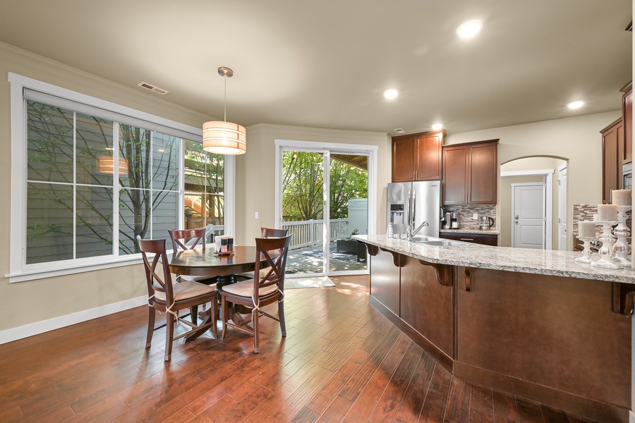 The open-concept dining area flows seamlessly into the kitchen—ideal for shared meals or takeout from nearby eateries.