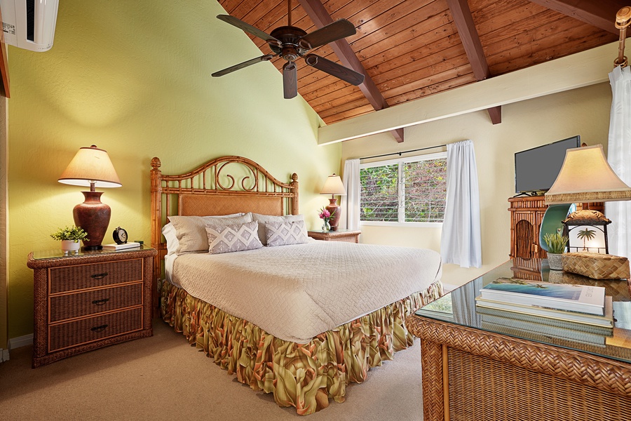 The primary bedroom has a king-sized bed, split AC and ceiling fan.