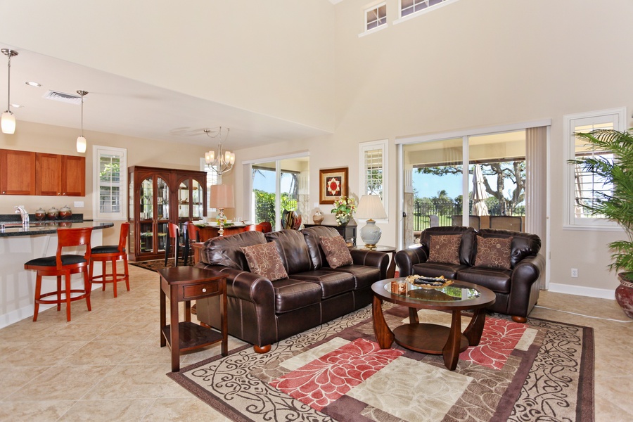 The expansive living and dining area with scenery from the lanai.