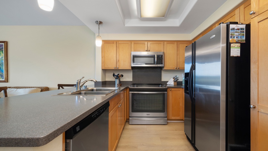 Enjoy the convenience of a fully equipped kitchen featuring stainless-steel appliances, granite countertops, and ample cabinetry for an effortless home-away-from-home experience.
