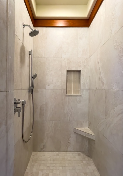 Guest Suite 2  enclosed shower view with elegant tilework and premium fixtures.