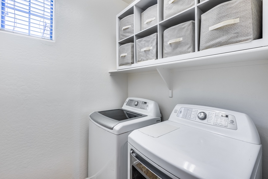 A roomy laundry space with washer/dryer and plenty of storage!