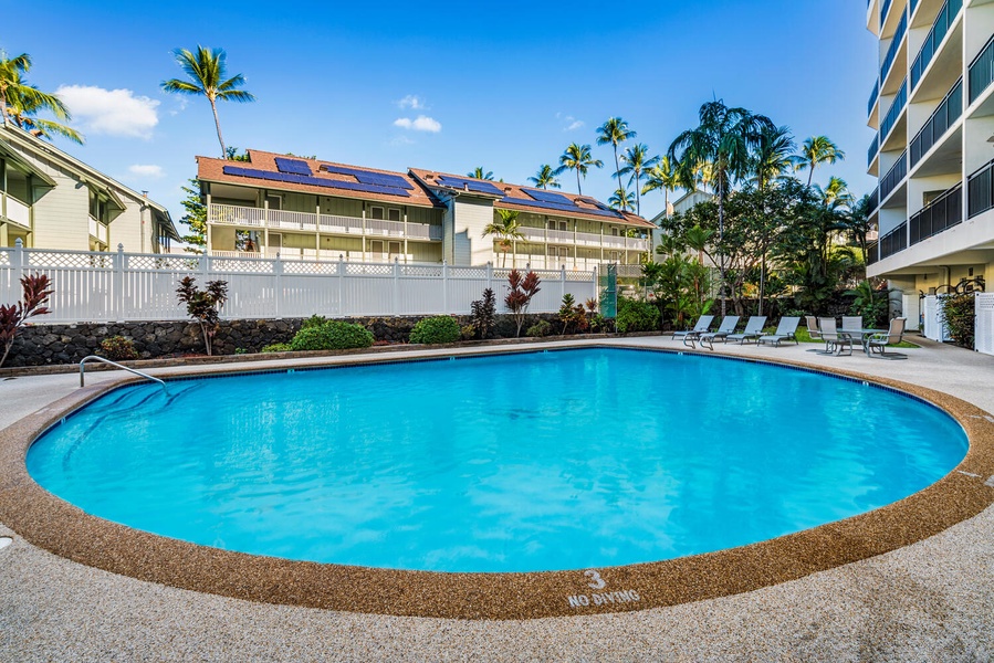 Kona Alii's pool with poolside loungers.