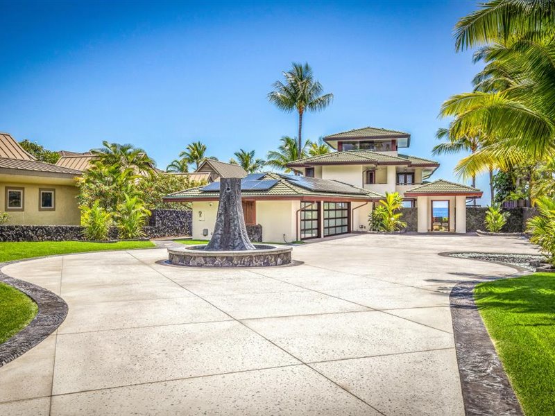 Grand entry to the property with wrap around driveway and water feature