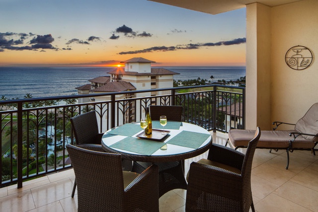 Scenic lanai offering stunning sunset views over the ocean.