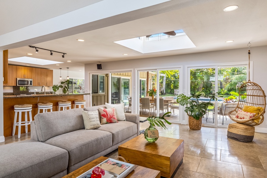 The living area opens directly to the lanai and pool deck