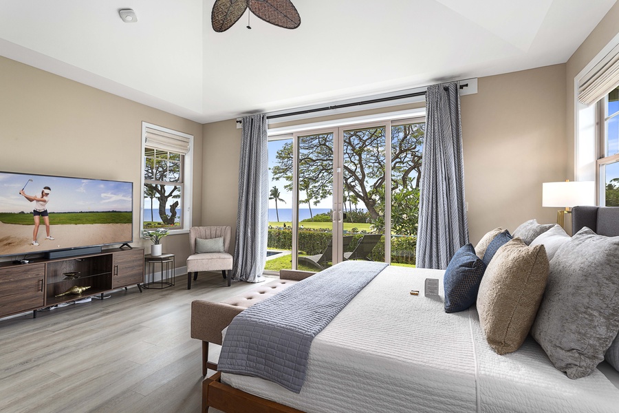 King bed in the primary suite, with a window desk for the mornings you can't fully log off.