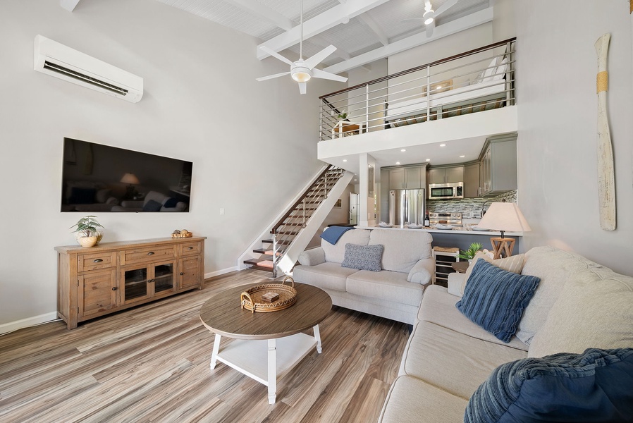 Open concept floor plan between living room and kitchen.