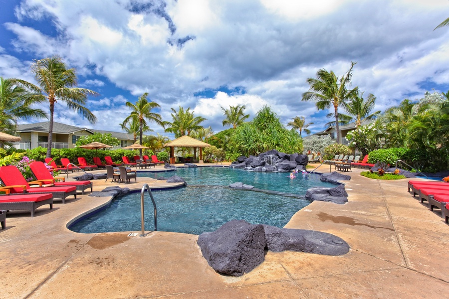 Community pool at Ko Olina Resort with loungers