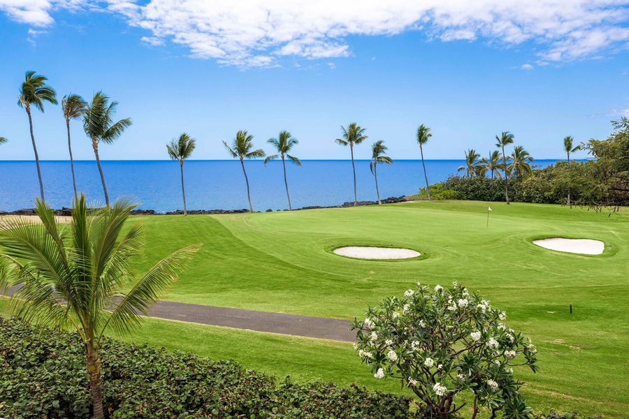 Pristine golf course with lush greens and ocean views.