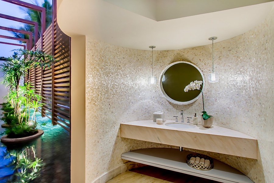A modern powder room with a stylish vanity.