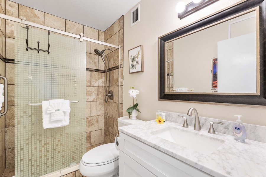 Chic ensuite bathroom featuring a streamlined single sink – a perfect blend of style and convenience for your personal retreat.