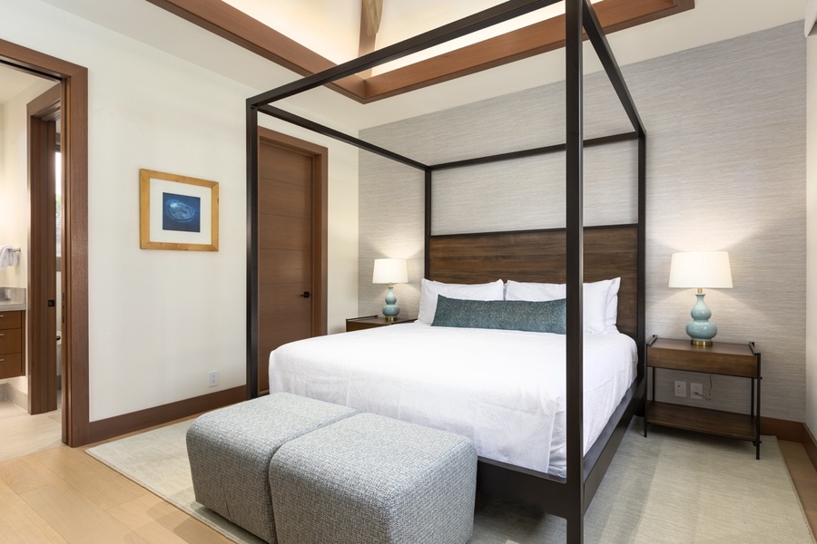 Guest suite three with a four-posted king bed and lofted ceilings.