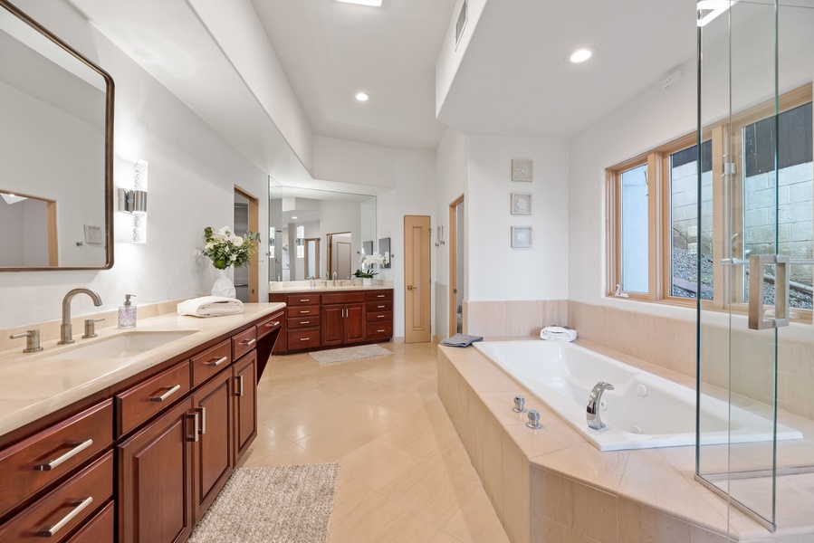Luxurious Priamary bathroom with jetted tub, glass shower, double vanities and huge walk in closet