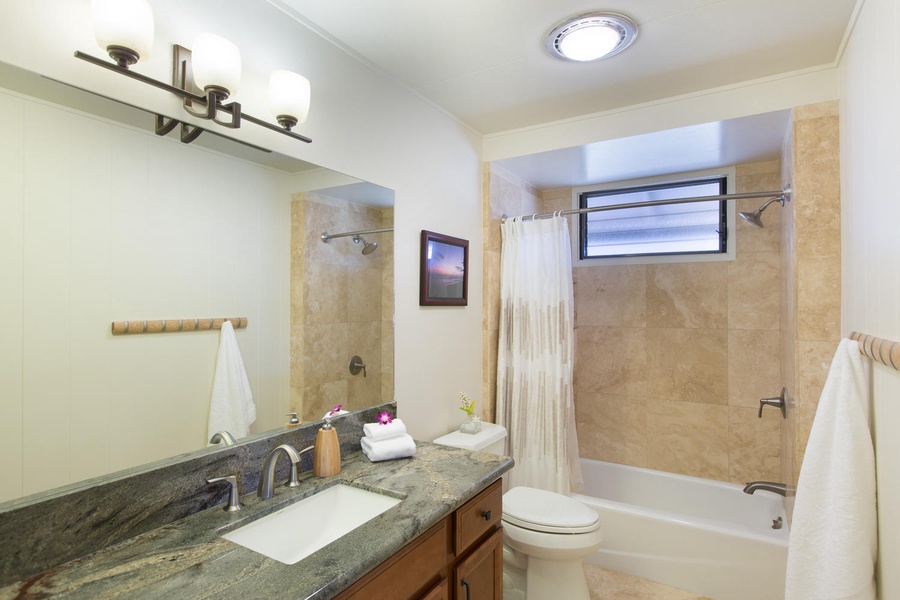 Beautifully remodeled shared bath for bedrooms two and three.