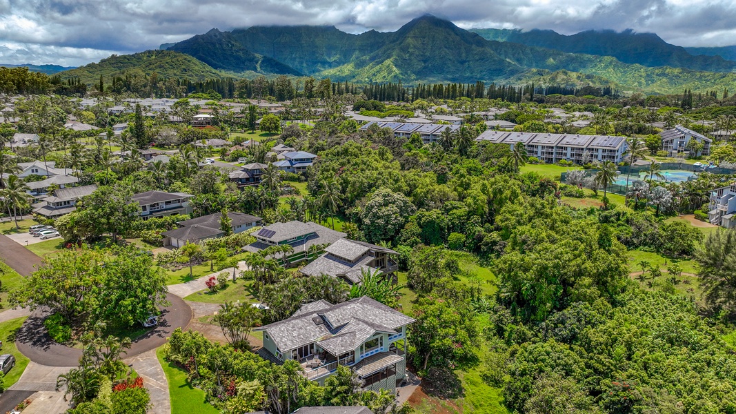 The distant mountains provide a majestic backdrop to the home.