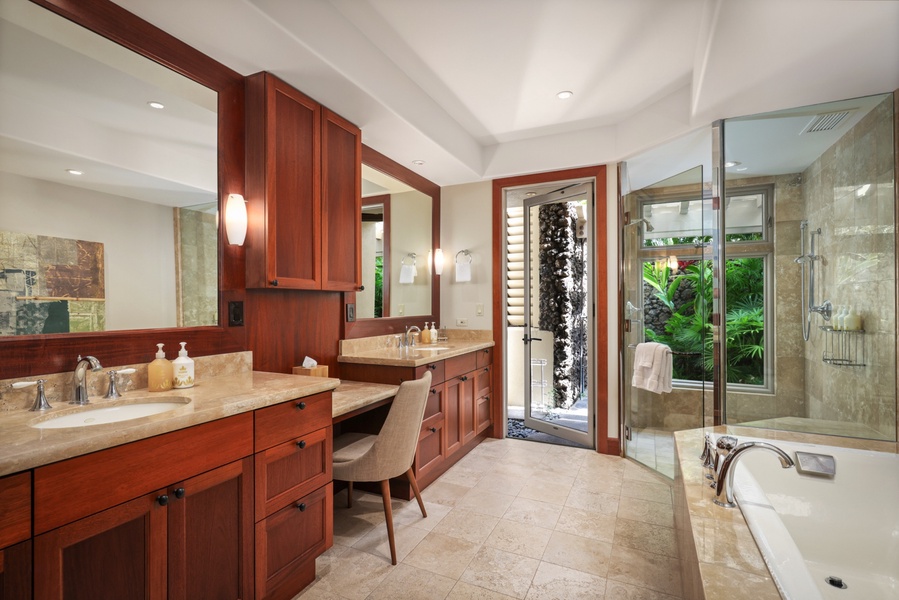 Primary ensuite bath with dual vanities, soaking tub, walk-in shower and outdoor shower garden.