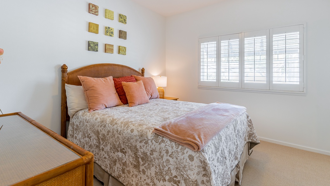 The cozy guest bedroom on the second floor with a view.