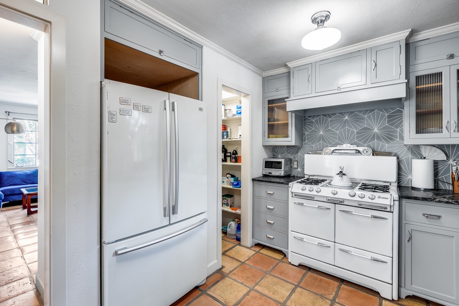 Full-stocked kitchen with ample appliances for your culinary ventures.