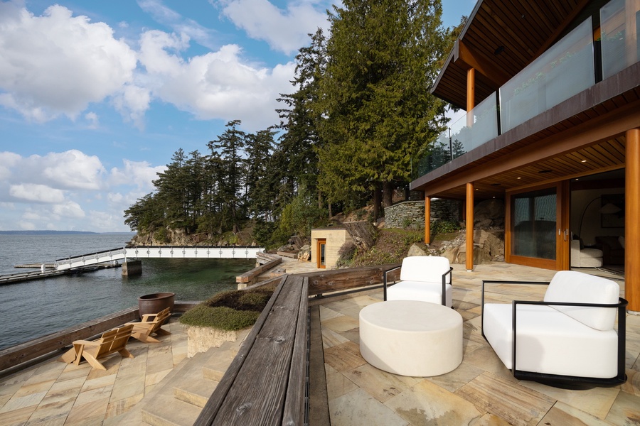 Stunning waterfront property featuring modern architecture with private dock access and pristine natural surroundings.