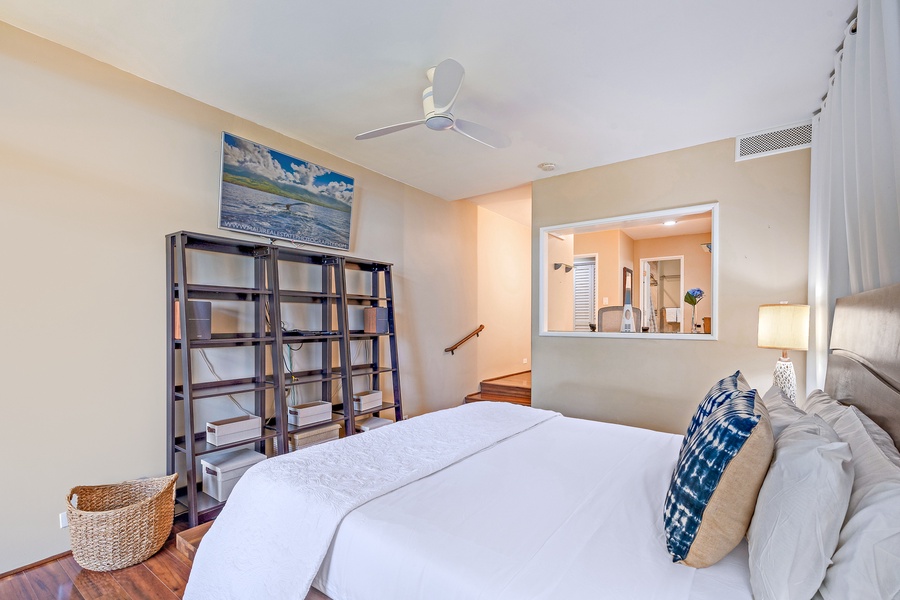 Relax in this cozy bedroom with modern decor and a calming ambiance.