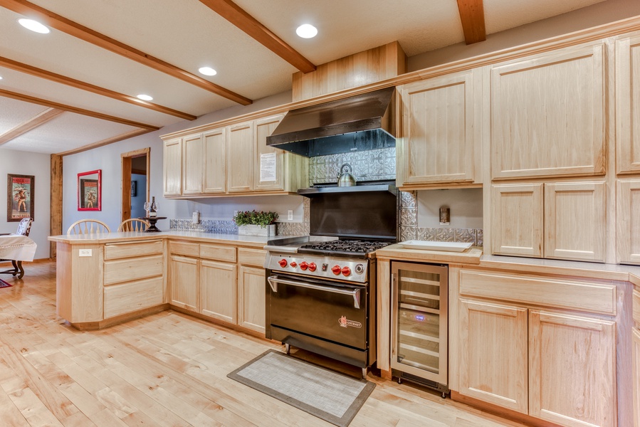Prepare your favorite dishes on the gas stove, along with a wine cooler and extensive counter space.