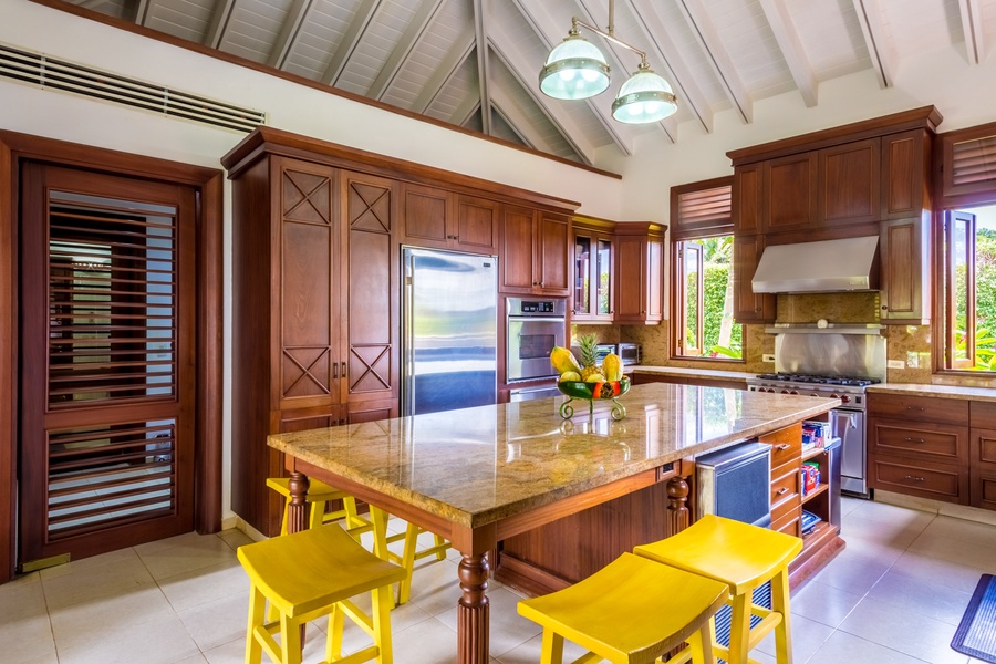 Explore your culinary expertise in the kitchen area with wide counter spaces, top tier appliances and a breakfast bar for five.