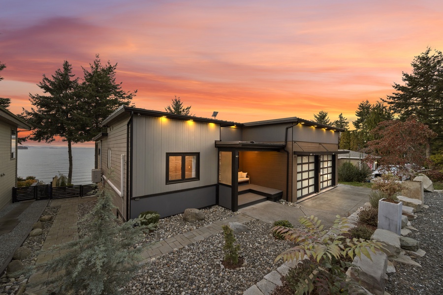 Modern architectural lines meet natural beauty — this hillside home blends seamlessly with its surroundings.