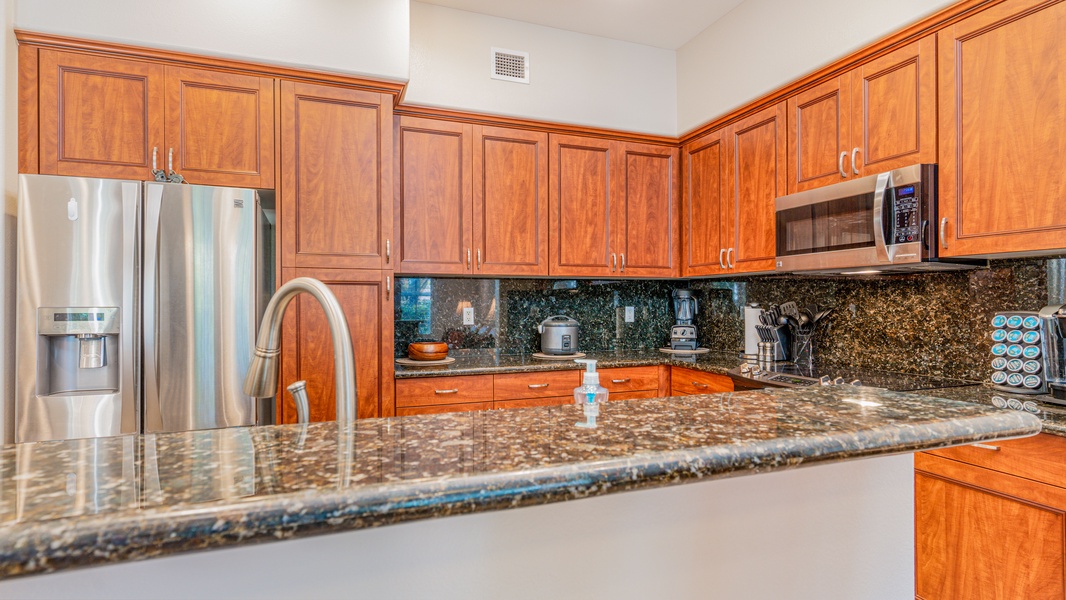 The high end kitchen area flows seamlessly with the living and dining rooms.