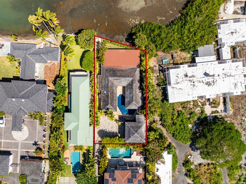 Top-down view of the property, highlighting the pool courtyard and tropical landscaping.
