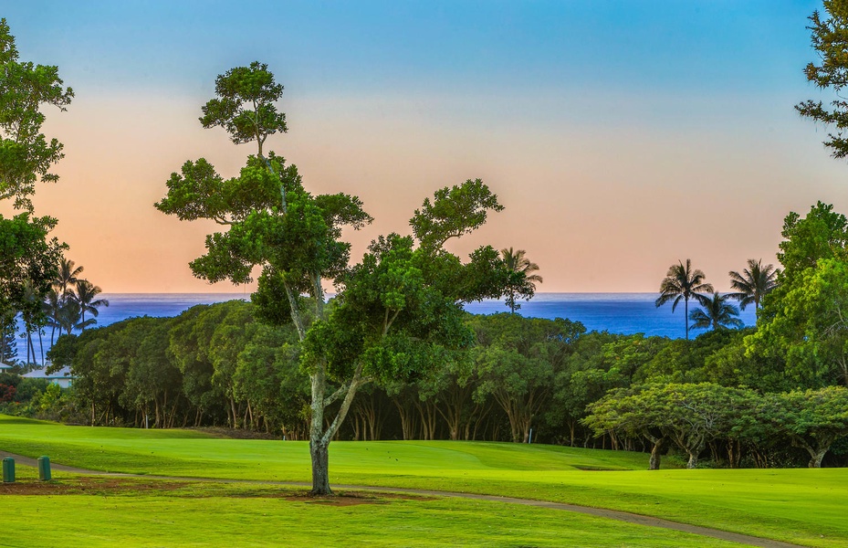 Expansive sunset views of the golf course and distant ocean, seen directly from the comfort of your private lanai.
