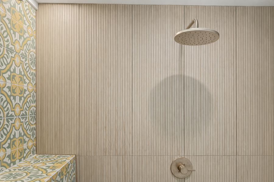 Rinse the day off in your spa-like shower with beautiful patterned tile accents and sleek modern fixtures.