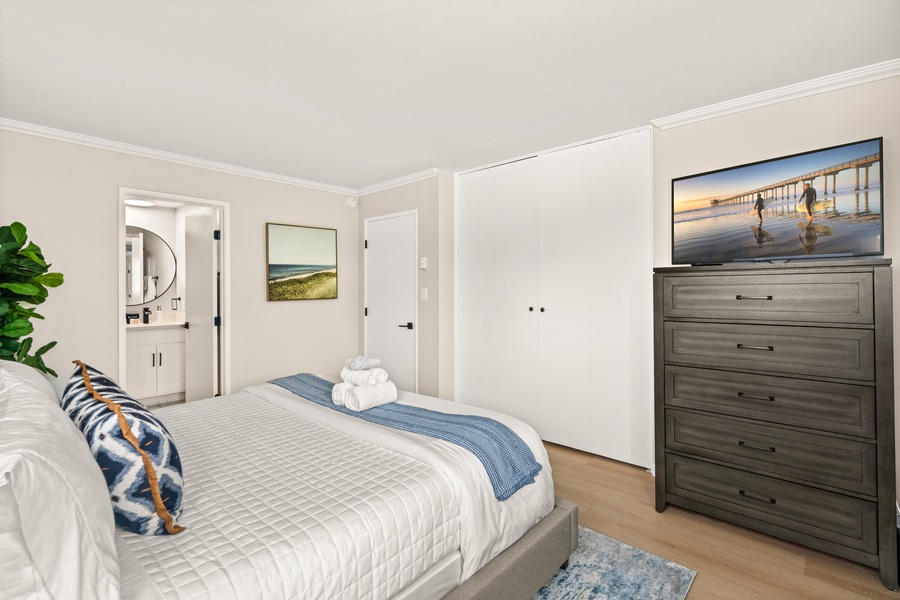 Ample storage and natural light in this cozy bedroom designed for extended stays.