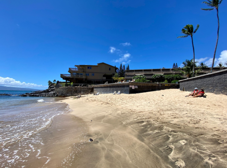 Relax on the quiet sands of this secluded beach, ideal for a peaceful day by the water.